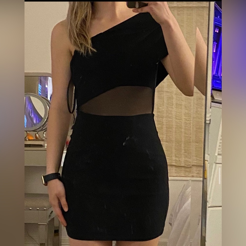 Revolve black dress. Brand new with tags. Size 4. Never worn
